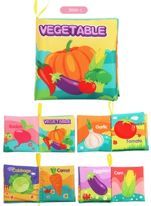 Macro view of soft fabric vegetable cloth book pages with colorful cartoon illustrations