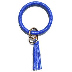 Close-up of royal blue litchi grain leather ring keychain with gold metal hardware and tassel