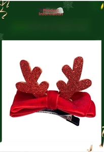 Detail view of red glitter reindeer antler hair clip with velvet bow and size measurements