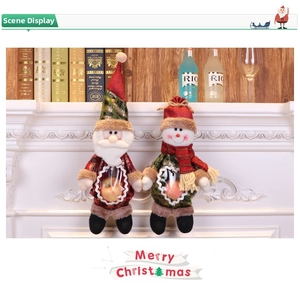 Christmas gift bag detail with transparent heart window and plush Santa decoration