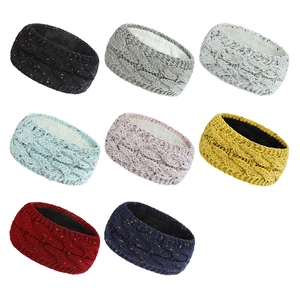 Close-up of thick knitted winter headbands in 8 colors with warm fleece lining detail