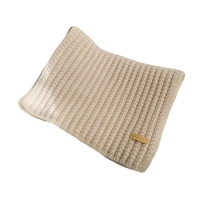 Thick beige ribbed knit scarf for winter warmth featuring a brown leather handmade label
