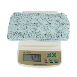 Light blue cable knit winter headband with colorful flecks weighing 42.9g for warmth