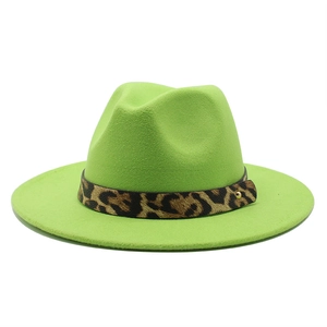 Green fedora wool hat with leopard print band and golden buckle on white background