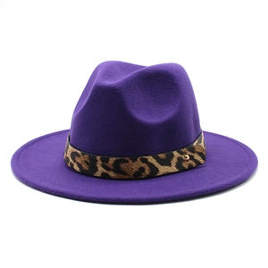 Detail of purple wool felt jazz hat featuring leopard print band and gold stud accent