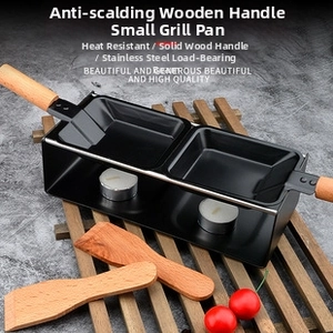 Mini raclette set with two non-stick pans, wooden handles and tea light candles