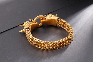 Macro shot of 316L stainless steel engraving on a gold dragon head link bracelet