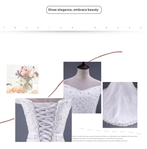 Dettaglio dell'abito da sposa in pizzo bianco con ricami eleganti e lacci corsetto sul retro