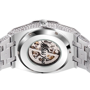 Silver full diamond mechanical watch with transparent back showing inner gears