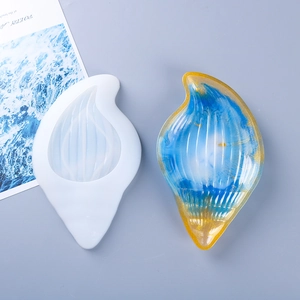 Macro detail of seashell silicone mold with blue and gold resin art finish