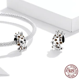 S925 sterling silver giraffe charm with brown enamel spots on a silver mesh bracelet
