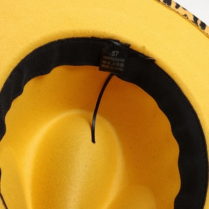 Macro detail of the interior label and adjustable sweatband of the leopard trim fedora