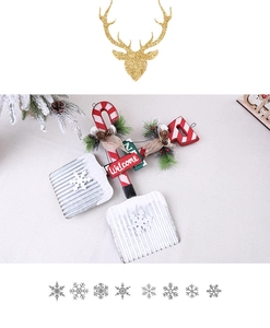 Detail of Christmas metal shovel stake with Welcome sign pine needles and burlap bow