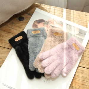 Detail of plush faux fur touchscreen gloves in four colors with cute leather bear patches