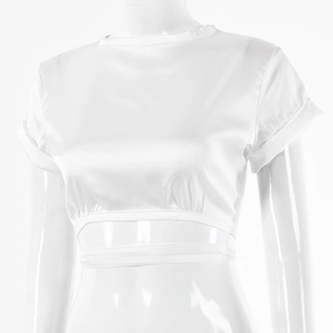 Detail view of white satin crop top with elastic drawstring hem and rolled sleeve cuffs