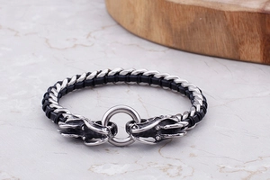 Close-up of retro dragon head bracelet with black woven leather and stainless steel