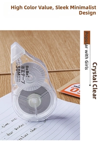 Detailed view of BoBo 30m correction tape on a notebook over a wooden desk surface