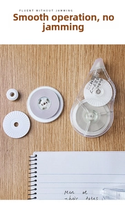 Detail of 30M PET correction tape with transparent shell on a wooden study desk