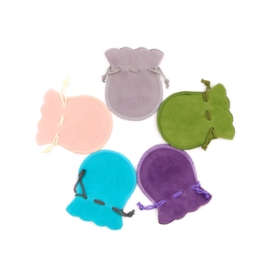 Velvet drawstring jewelry pouches in five vibrant colors with elegant ruffled edges