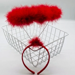 Detail of red feather halo headband on a thin wire base for festive parties