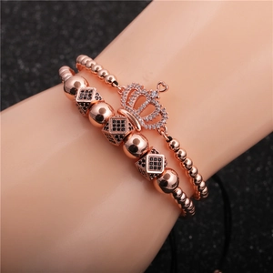 Rose gold crown bracelet set with black and white cubic zirconia on a model wrist