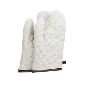 Professional heat resistant white quilted cotton oven mitts with brown trim and hanging loop