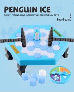 Components of Penguin Trap board game including ice blocks, mallets, and penguin toy