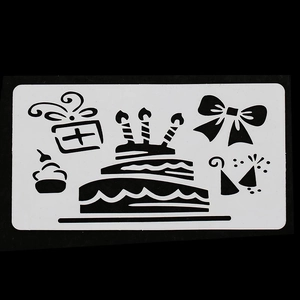 Detail of white PET birthday stencil with cake and gift box cutouts for DIY crafts