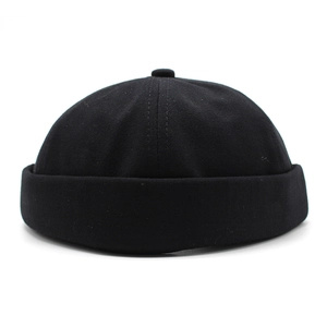 Minimalist black cotton miki hat with retro six-panel dome and rolled cuff design