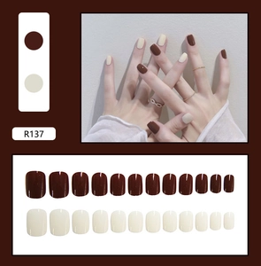 Detail view of R137 press-on nails set in chocolate brown and creamy white finish