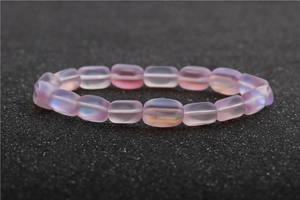 Detailed close-up of matte lilac moonstone bead bracelet with pearlescent finish