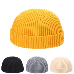 Classic knitted docker cap in yellow, black, grey and beige with ribbed texture details