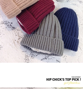 Detail of warm winter beanies with thick fleece lining in various classic colors