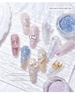 Macro detail of handmade press-on nails with sparkling diamond glitter and 3D floral charms