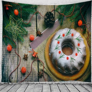 Christmas tapestry featuring festive cake and pine branches on white brick wall background