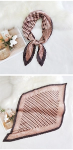 Detail of pleated silk scarf with geometric patterns and vintage floral print borders