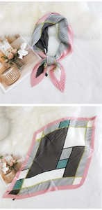 Detailed view of pleated silk scarf featuring retro geometric patterns and polka dots