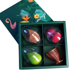 Green tropical gift box featuring 3 makeup sponges in shells and a rose gold metal stand