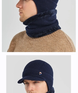 Close-up of navy blue knitted hat and fleece-lined neck warmer set for outdoor warmth