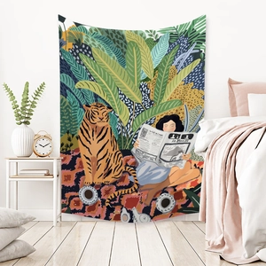 Bohemian forest tapestry with tiger and woman reading Le Monde over bedroom bed