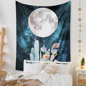 Detail of bohemian moon phase tapestry with stars and blooming cactus wall hanging