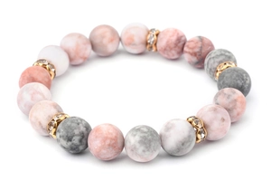 Detail of natural stone beads in pink and grey with gold rhinestone-set spacer accents