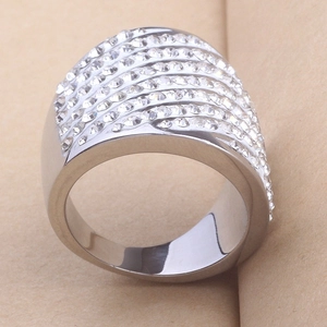 Detailed shot of a wide stainless steel band with nine rows of sparkling rhinestones