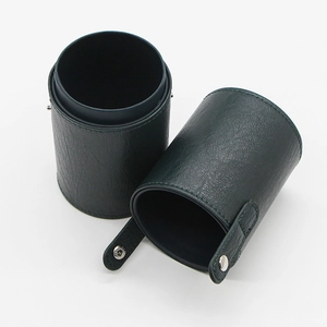 Detail view of dark green PU leather makeup brush holder with secure snap button closure