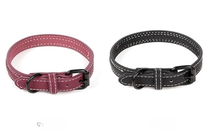 Close-up of wine red and black PU leather pet collars with white stitching and metal buckles