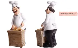 Detailed resin chef figurine carving bread on wooden counter, 23x11 cm decorative ornament