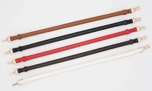 Detailed view of 5-color PU leather bag straps with golden spring buckles on white background
