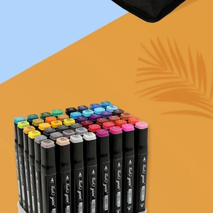 Detail view of dual-tip markers with color-coded caps and fine/broad nib labels