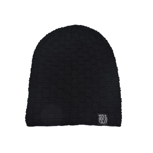 Detail of black knit beanie with textured check pattern and small bear graphic patch