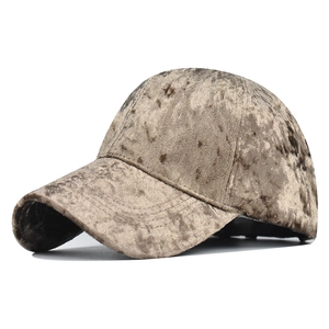 Detailed texture of thick brown chenille fabric on a classic six-panel baseball cap